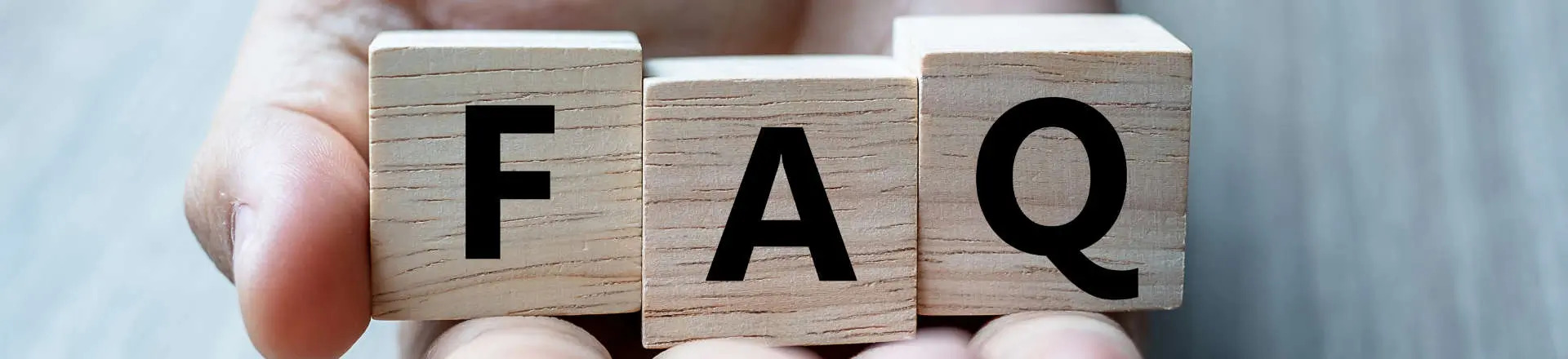 wooden blocks with letters that read FAQ